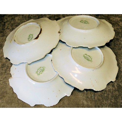 58 - A Set of 7 Victorian Round Scalloped Plates on white and green ground with figure, boat, floral and ... 