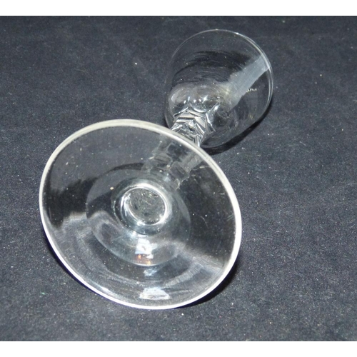 6 - A Georgian Cordial Glass having cut chamfer stem on round sweeping base, 15cm high