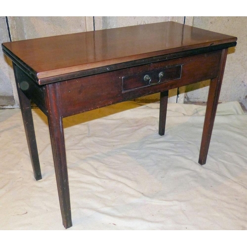 826 - A 19th Century Mahogany Tea Table having hinged top, centre small drawer on square tapering fluted l... 