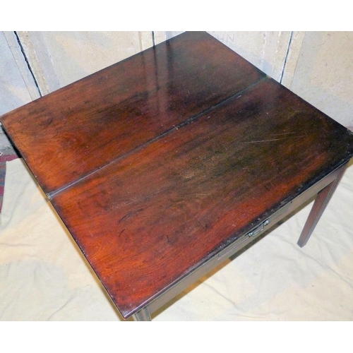 826 - A 19th Century Mahogany Tea Table having hinged top, centre small drawer on square tapering fluted l... 