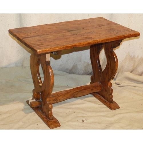 833 - A Heavy Oak Coffee Table having chamfer rim on pierced splat end supports with centre stretcher, 67c... 