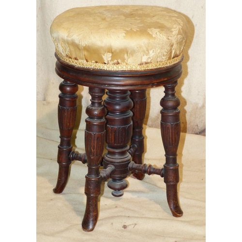 834 - A 19th Century Mahogany Circular Swivel Top Piano Stool having overstuffed cream floral seat on roun... 