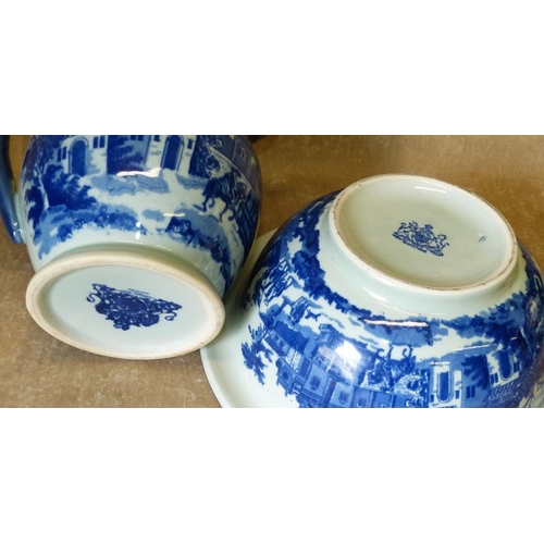 103 - A Modern Blue and White Ironstone Toilet Jug and Basin having figure, horse and building decoration ... 