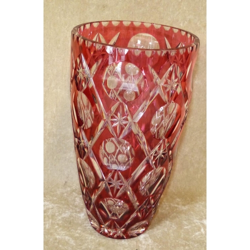 106 - A Ruby and Clear Cut Glass Bulbous Trumpet Shape Vase having thumb pattern rim, 25cm high  