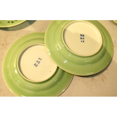 115 - A Set of 12 Cantonese Plates on green ground with multicoloured bird and floral decoration, 18.5cm d... 