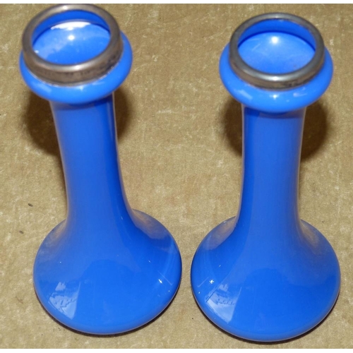 128 - A Pair of Blue Glass Bulbous Shape Vases having silver necks, 19cm high  