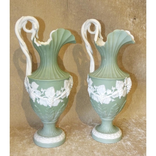 157 - A Pair of Minton Style Bulbous Shape Ewers on green and white ground with raised grape, vine and scr... 