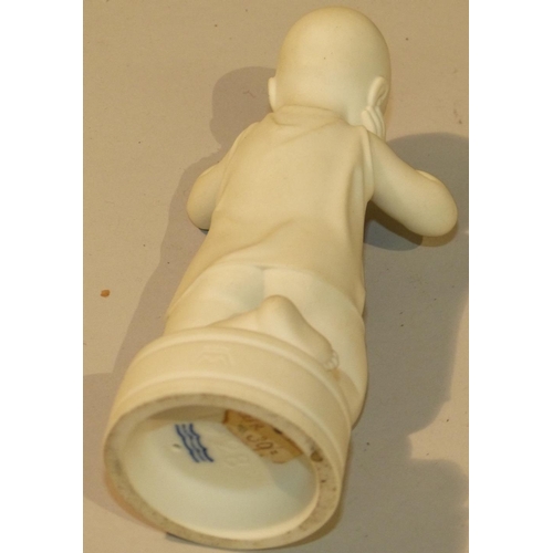 183 - A Copenhagen Bisque Figure of a Kneeling Child on round base, 15cm high  