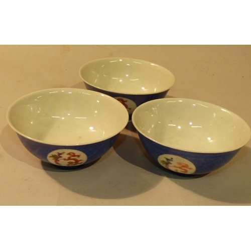 30 - A Set of 3 Oriental Round Trumpet Shape Bowls on blue and white ground having multicoloured panels o... 