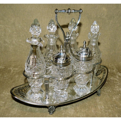 307 - A Silver Plated Boat Shape Frame with centre carrying handle, mounted with 6 cut glass condiments on... 