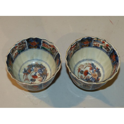 31 - A Pair Oriental Imari Pattern Round Trumpet Shape Tea Bowls having multicoloured river landscape, fi... 