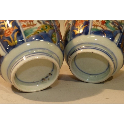 31 - A Pair Oriental Imari Pattern Round Trumpet Shape Tea Bowls having multicoloured river landscape, fi... 