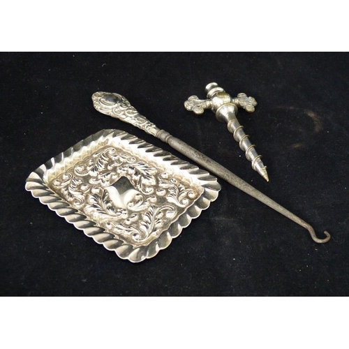 317 - A Silver Plated Champagne Tap, a silver handle button hook and a small rectangular dish with embosse... 