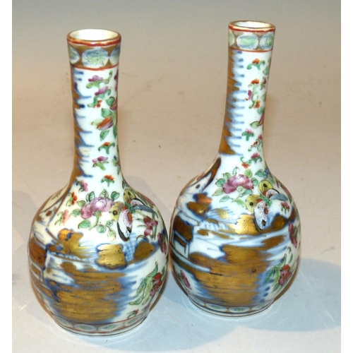 32 - A Pair 19th Century Cantonese Bulbous Thin Neck Vases having multicoloured river landscape, butterfl... 