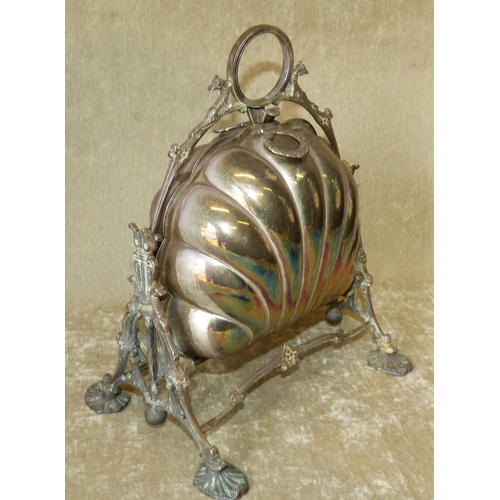 321 - A Silver Plated Shell Shape Biscuit Barrel having folding centre enclosing pierced liners, centre ca... 