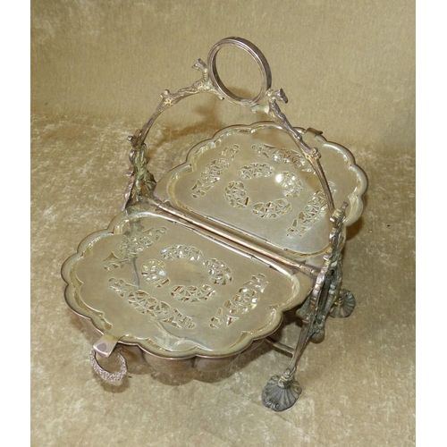 321 - A Silver Plated Shell Shape Biscuit Barrel having folding centre enclosing pierced liners, centre ca... 