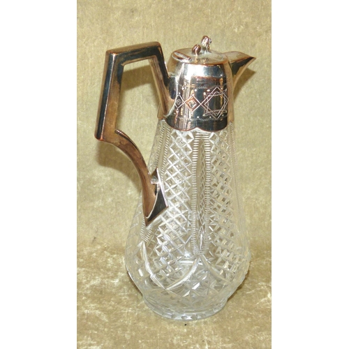 326 - A Cut Glass Round Bulbous Shape Claret Jug having silver plated neck, handle and hinged lid with lio... 