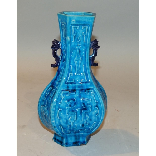 34 - An Oriental Bulbous Thin Neck 2-Handled Trumpet Shape Vase having all over chamfer decoration, on tu... 