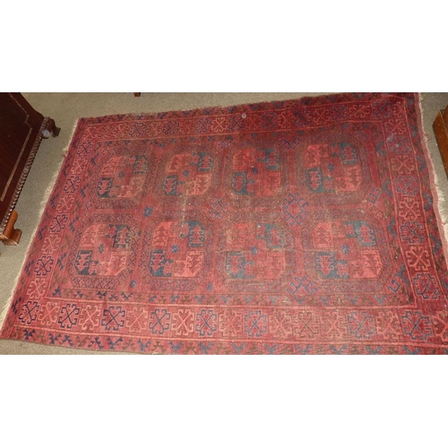 601 - A Bokhara Rug on red ground having 2 x 4 centre medallions, 2m 6cm x 1m 46cm (slight wear)  