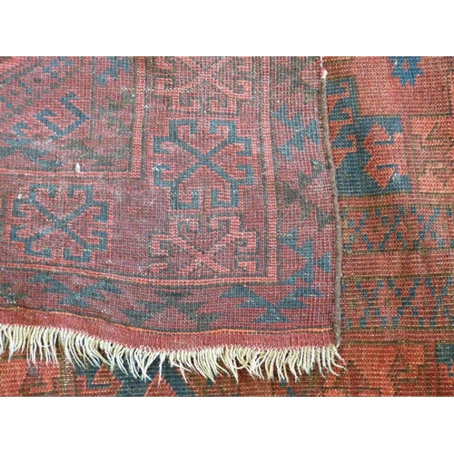 601 - A Bokhara Rug on red ground having 2 x 4 centre medallions, 2m 6cm x 1m 46cm (slight wear)  