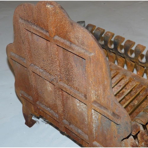 606 - A Cast Iron Fire Grate with scalloped back on splayed legs, 40cm wide, also another fire grate with ... 