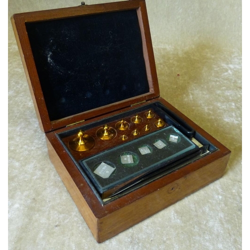 614 - A Set of Balance Scale Weights in fitted mahogany case, 13cm wide  