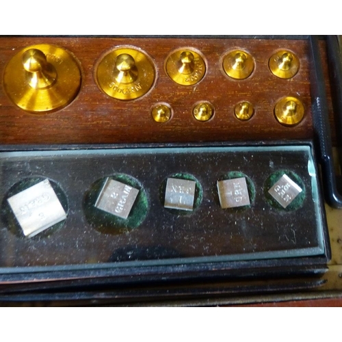 614 - A Set of Balance Scale Weights in fitted mahogany case, 13cm wide  