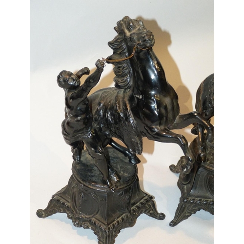 620 - A Pair of Black Painted Spelter Marley Horses on square bases with splayed feet, 34cm high  