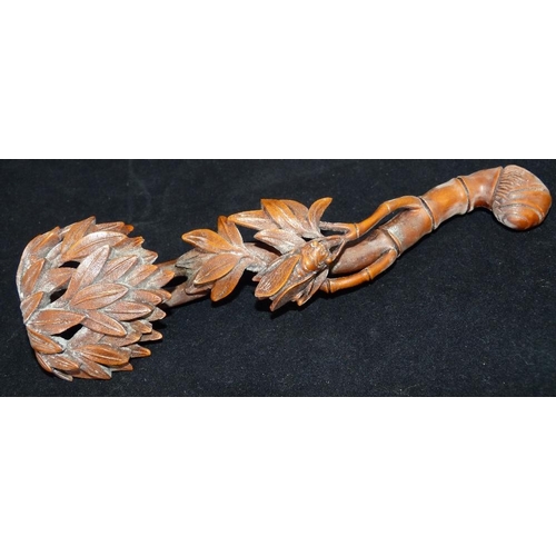 624 - An Oriental Bamboo Sceptre having carved insect and leaf decoration, 20cm long  