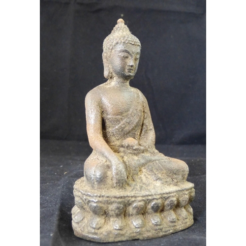 625 - A Metal Figure of a Seated Buddha, 12cm high  