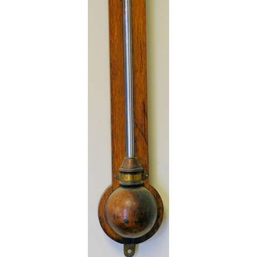 630 - A 19th Century Oak Stick Barometer with thermometer, 94cm high  