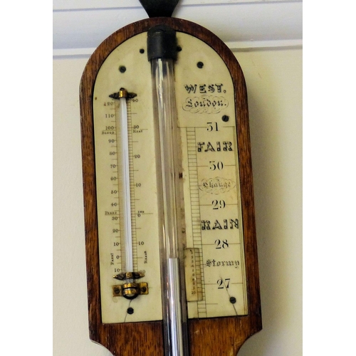 630 - A 19th Century Oak Stick Barometer with thermometer, 94cm high  