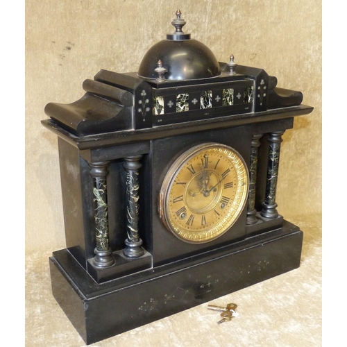 633 - An Ansonia Clock Co, Black Slate 8 Day Striking Mantle Clock having Corinthian column supports, gilt... 