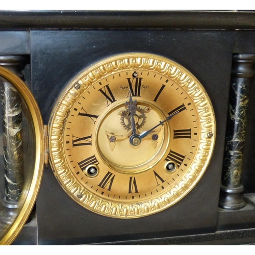 633 - An Ansonia Clock Co, Black Slate 8 Day Striking Mantle Clock having Corinthian column supports, gilt... 