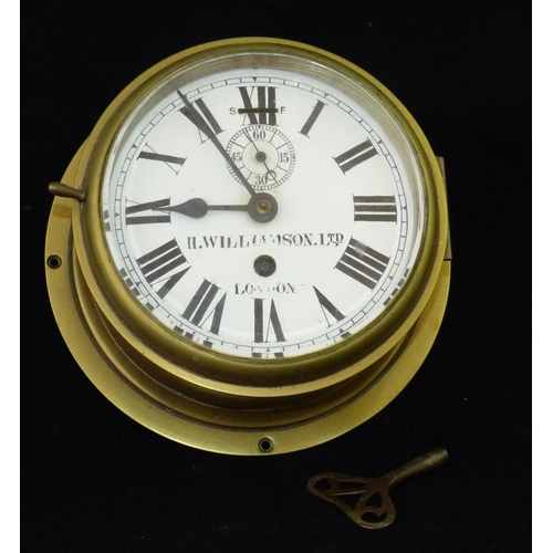 638 - H Williamson Ltd, London Brass Circular Wall Clock having white enamel dial with seconds dial, Roman... 