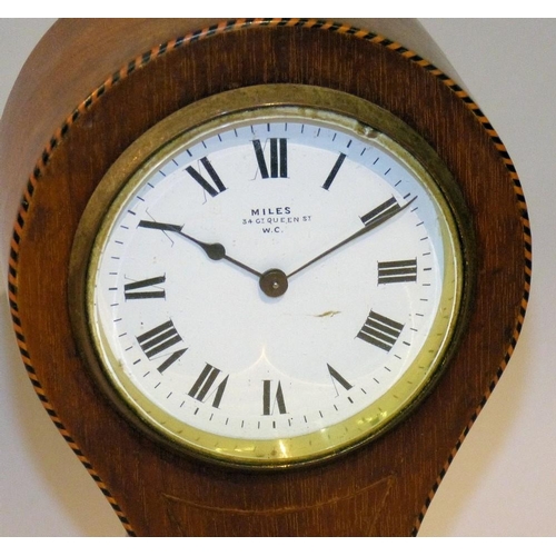 639 - An Edwardian Mahogany Balloon Mantle Clock having inlaid boxing, white enamel dial with Roman numera... 