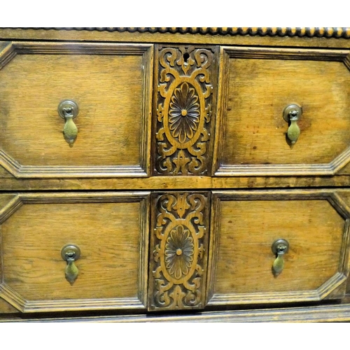 649 - A 1920's Oak Jacobean Style Sideboard having lipped back with bulbous support, 2 drawers to centre f... 