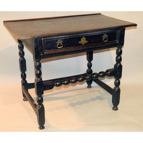 651 - An 18th Century Oak Side Table having plank top, 1 x long drawer having drop brass handles, on bobbi... 