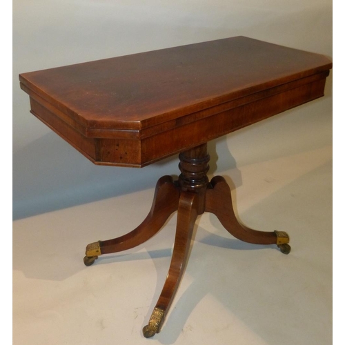 655 - A 19th Century Mahogany Card Table having chamfer corners on round gun barrel stem with 4 splayed le... 