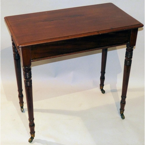 706 - A Victorian Mahogany Rectangular Occasional Table on round turned ringed legs, with brass toes and c... 