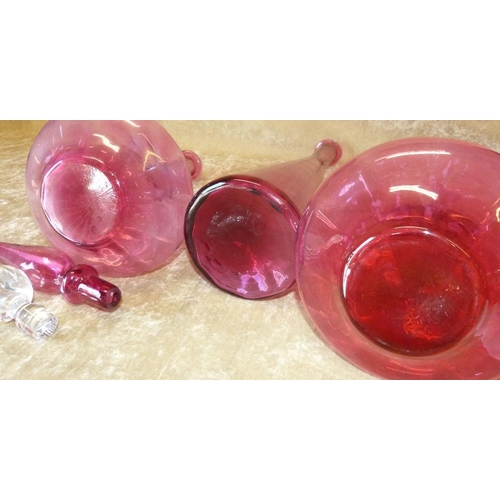 80 - A Pair of Cranberry Glass Bulbous Thin Neck Decanters (1 with stopper) 39cm high, also another talle... 