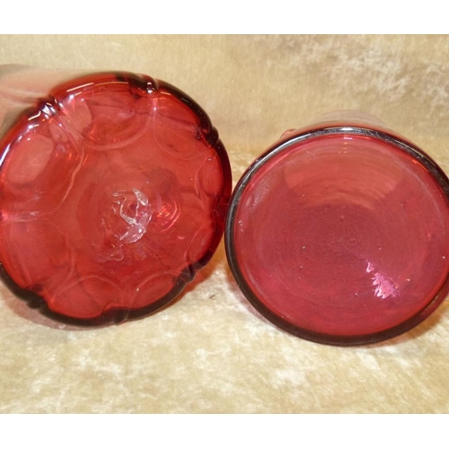 82 - A Cranberry Glass Jug, 19cm high, also a smaller Cranberry glass jug, 16cm high (2)  