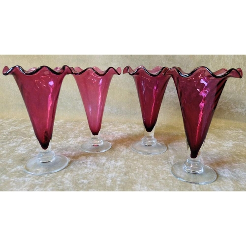 83 - A Set of 4 Cranberry Glass Round Trumpet Shape Vases having crinkled rims on clear round bases, 18cm... 