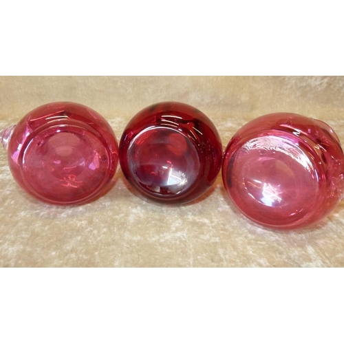 84 - A Set of 3 Cranberry Glass Bulbous  2-Handled Trumpet Shape Vases having crinkle rims, 13cm high (3)... 