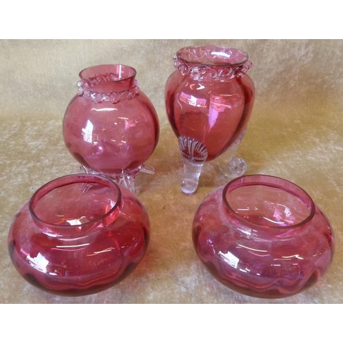 87 - A Cranberry Glass Bulbous Egg Shape Vase having clear scroll shape feet, 16cm high, another similar ... 