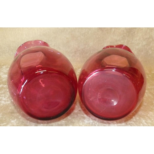 96 - 2 Cranberry Bulbous Trumpet Shape Jugs having crinkled rims with clear glass handles, largest 21.5cm... 