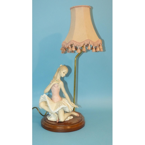 23 - A Nao Style China Lamp in form of a ballerina on hardwood stand with lamp, 60cm high