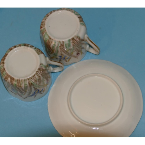 41 - A Set of 6 Japanese China Cups and Saucers on white ground with multicoloured floral and leaf decora... 