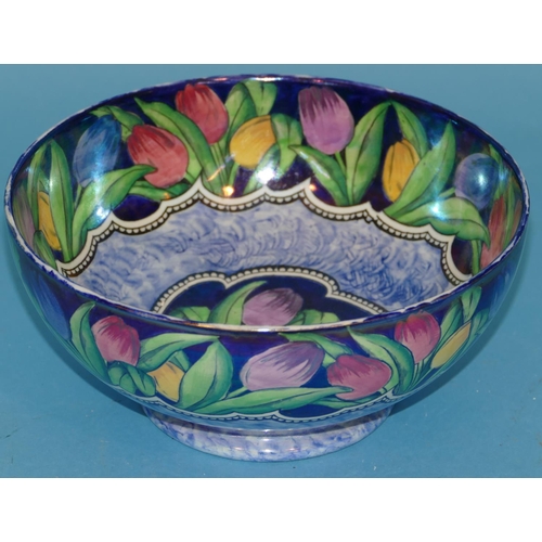 45 - A Maling Round Bowl on blue ground with multicoloured tulip and leaf decoration, 21.5cm diameter