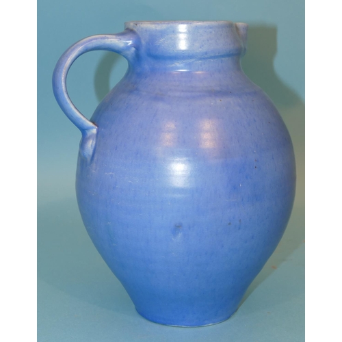 59 - A Brannam Ltd Bulbous Thin Neck Jug on blue ground, 24cm high